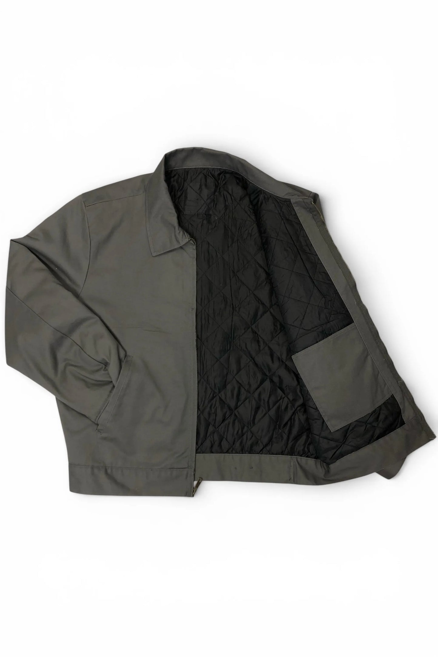 Common Saints dark gray mechanic jacket shown open with black diamond-quilted lining and interior patch pocket